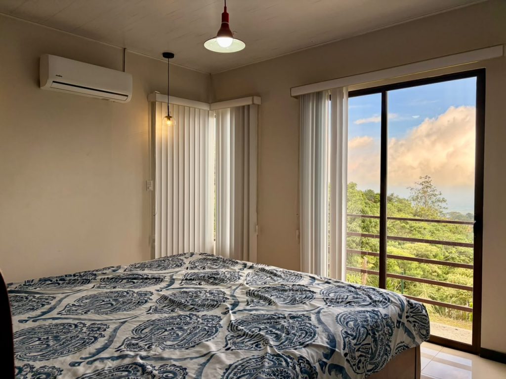 Bedroom with wall-mounted air conditioning in a Costa Rica rental property