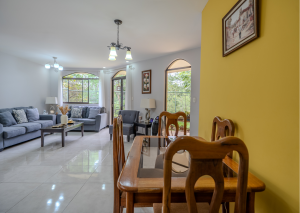 Spacious living and dining area inside a colonial home in Valle Flores, Grecia